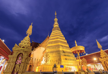 Fototapeta premium Golden pagoda for year of tiger at Wat Prathat Cho Hae Temple in Phrae province, north of Thailand