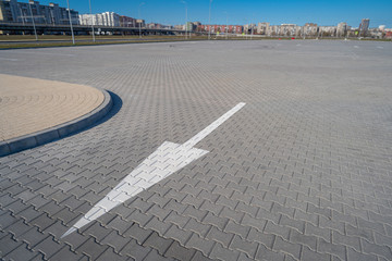 Fototapeta premium Open space with road signs and road markings, road intersections, pedestrian crossings, sunny day, blue sky, city landscape background