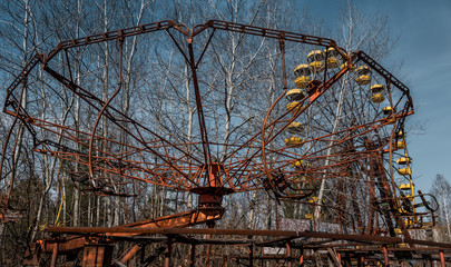 Old ferris wheel in the ghost town of Pripyat. Consequences of the accident at the Chernobil...
