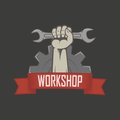 Color illustration of the hand holding a key, a banner with text and a circular saw. Workshop logo