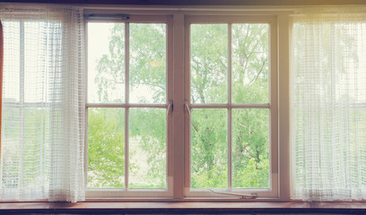 Window with curtains and green nature view , vintage design