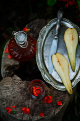 pear-cranberry liqueur.style vintage. selective focus