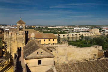Fototapeta na wymiar View of Tower of Homage and Roman Bridge over Guadalquivir river from Tower of Lions Alcazar Cordoba