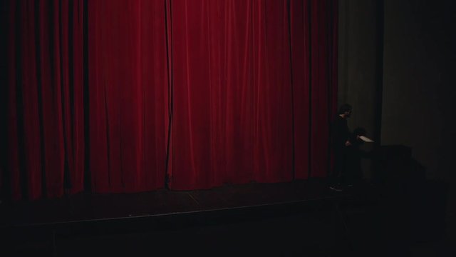 Actor in a theatre reviewing the script
