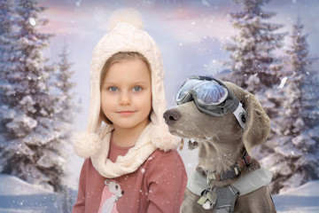 Little girl on the background of winter landscape