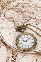 Fototapeta na wymiar Vintage pocket watch clock on ancient map background