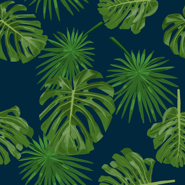 Exotic tropical background with monstera and palm leaves on navy blue. seamless pattern.