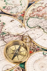 Fotobehang Compass on vintage ancient map, concept for direction transportation and travel © wirojsid
