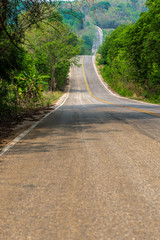 Country road in the forest , Highway road in Thailand between the hills.