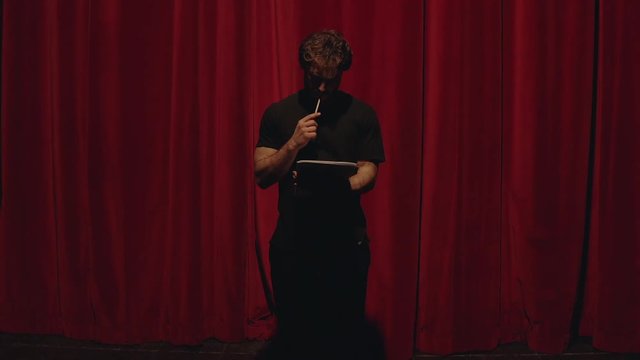 Actor in a theatre reviewing the script