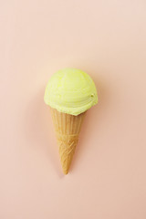 Ice-cream scoop in waffle ice cream cone on pastel background. Summer, heat, vacation, refreshment,...