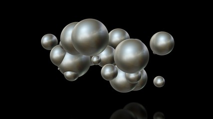 3D illustration of metal balls of different sizes randomly arranged in space and penetrating into each other. A futuristic image, an abstraction. 3D rendering isolated on black background.