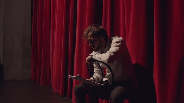 Actor in a theatre reviewing the script