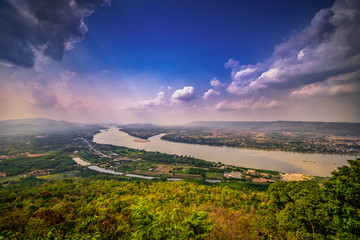 Top view of border near Mekong river with mountain and cloudy sky and tree from NongKai, Thailand
