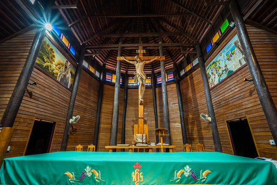 YASOTHON, THAILAND - APRIL 1, 2019 : The largest wooden Christian church in Thailand and up to 100 years old, Ban Song Yaeng Church, Yasothon Province, built in Thai style..