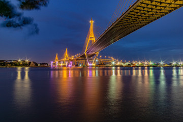Fototapeta na wymiar Bhumibol Bridge, Chao Phraya River Bridge. Turn on the lights in many colors at night.