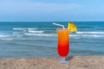 Fruit punch on the beach, refreshing fruit punch mocktail and summer drinks.