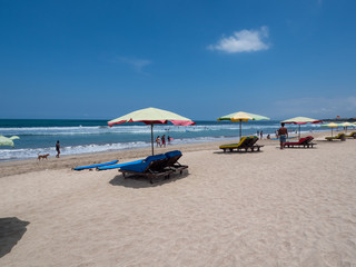Fototapeta na wymiar Bali, November 2019: Located on the western side of the island's narrow isthmus, Kuta Beach is Bali's most famous beach resort destination. Indonesia