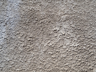 The old gray plaster is covered with cracks, scratches.