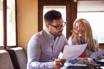 The handsome young bearded biznsmen is very skeptical because he reads the results of his company's...