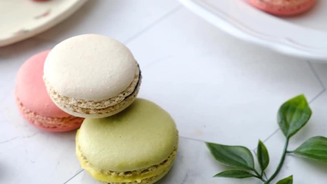 Colorful French macarons cakes desert set on party table.
