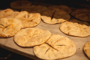 Italian focaccia/pizza near a furnace in a restaurant