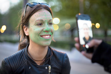 face recognition software working while photographing a young woman