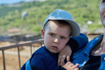 Young baby boy with a blue eyes ourdoors