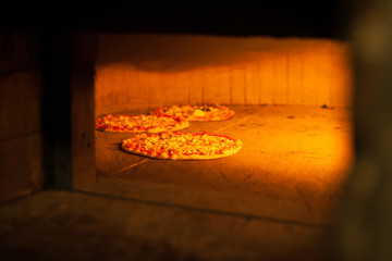 Italian focaccia/pizza near a furnace in a restaurant