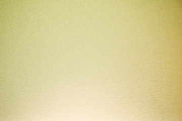 Fully blurred textural background of cream and yellow