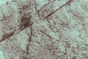 Vintage cyan background. Rough painted wall of hazel color. Imperfect plane of brown colored. Uneven old decorative toned backdrop of blue tint. Texture of azure hue. Ornamental stony surface.