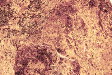 Vintage yellow background. Rough painted wall of aspen gold color. Imperfect plane of golden colored. Uneven old decorative toned backdrop of yellow tint. Texture of gold hue. Ornamental stony surface