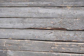 Background of black flaky wood Backdrop of black colored wooden panels with aged flaky surface