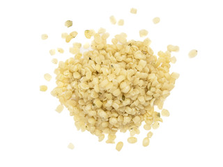 Pile of shelled or peeled hemp seeds seen directly from above and isolated on white background