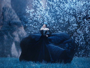 queen of night in luxurious black dress with long flying train, lady with dark makeup, metal cold...