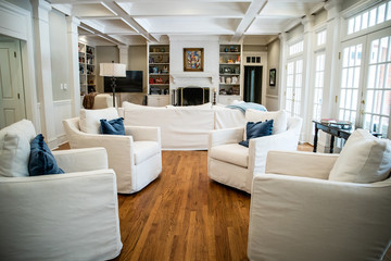 Large Living Room Den in Home with Vaulted Tray Ceiling and bookshelves
