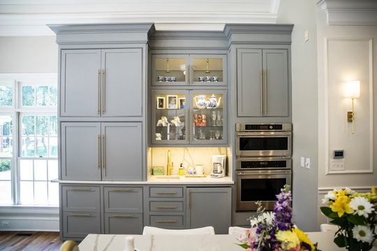 Gray Grey modern Kitchen cabinets in a large expensive kitchen