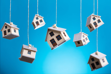 Model Houses Hanging By Strings