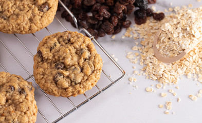 Cinnamon Raisin Oatmeal Cookies with Ingredients on a Marble Counter