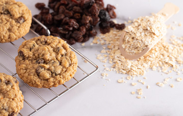 Cinnamon Raisin Oatmeal Cookies with Ingredients on a Marble Counter