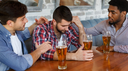 Consoling Depressed Friend. Men Drinking Beer And Talking
