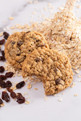 Cinnamon Raisin Oatmeal Cookies with Ingredients on a Marble Counter