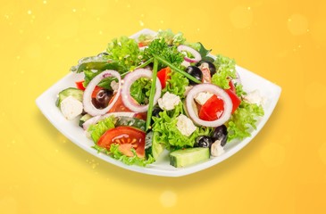 Fresh tasty vegetable salad in bowl on white background