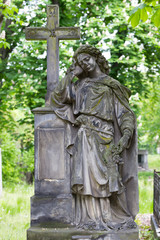Historic Statue on the mystery old Prague Cemetery, Czech Republic