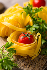 Raw pasta tagliatelle or fettuccine