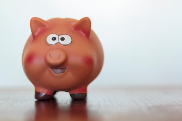 Piggy bank on wooden table