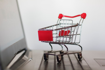 Shopping cart on computer keyboard. Online shopping concept