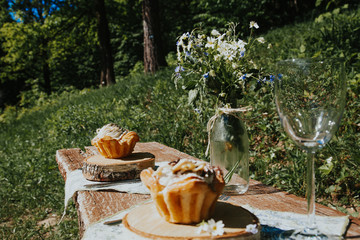 Glass and cake on a Sunny table, a bouquet of spring flowers for mood