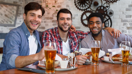 Friends Meeting. Men Sitting In Beer Pub