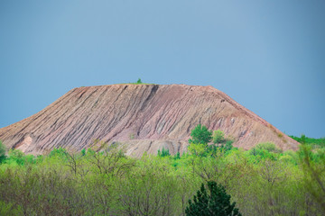 View of spoil tip in green steppe